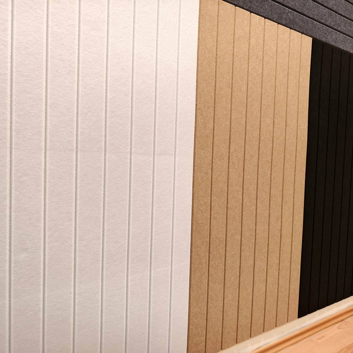 Panneaux antibruit Bilnora installés sur un mur mitoyen afin de compléter une solution d’isolation phonique multicouche